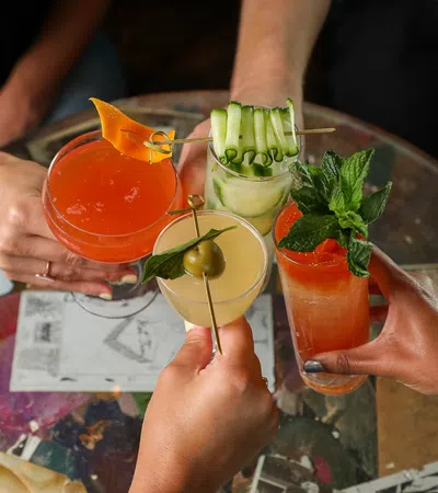 a group of people holding drinks