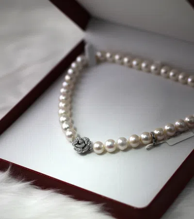 a gold bracelet on a book