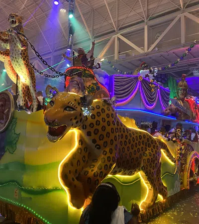 a group of people in a room with a carousel