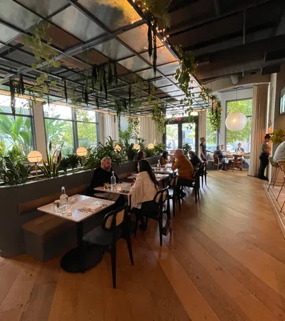 a group of people sitting at tables