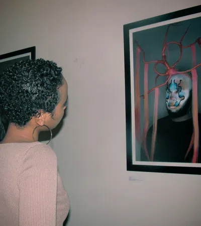 a man looking at a painting
