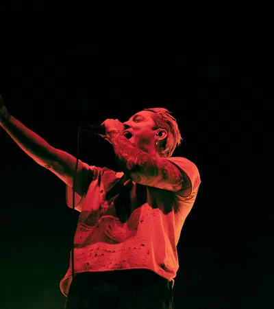 a person singing into a microphone