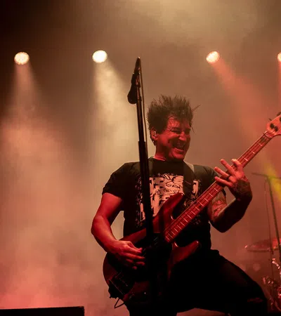 a man playing a guitar on a stage
