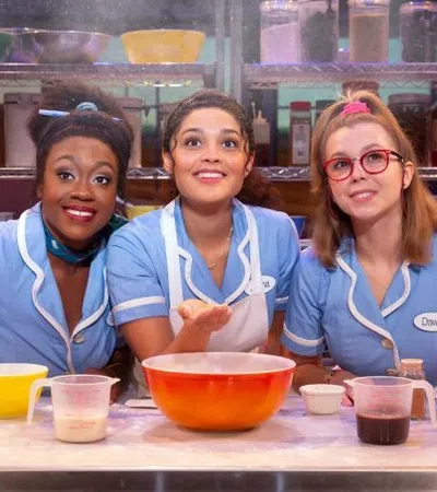 a group of girls in blue shirts