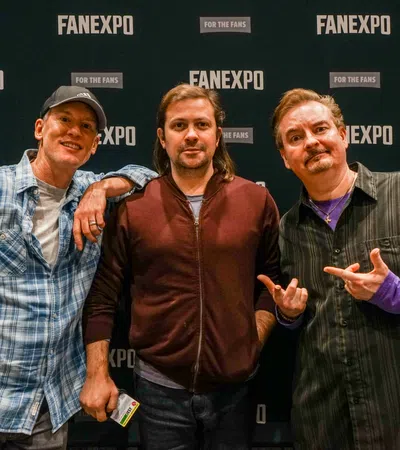 a group of men posing for a photo
