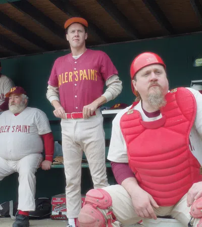 a group of baseball players posing for a photo
