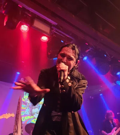 a person singing into a microphone