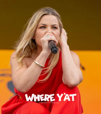 a woman singing into a microphone