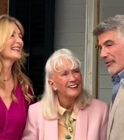 Bryan Batt et al. standing together smiling
