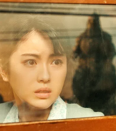 a woman looking at the camera