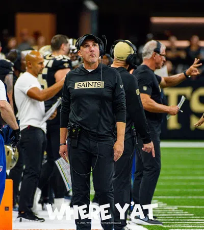 a football coach talking to his team