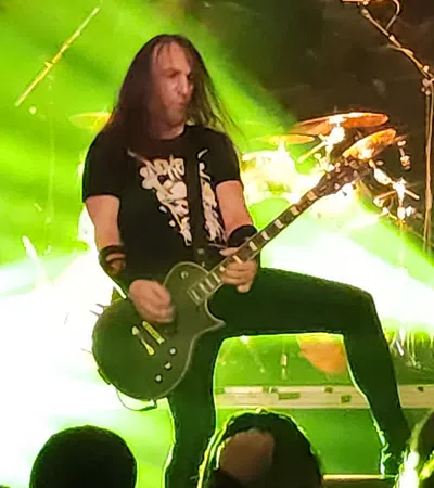 a person playing a guitar on a stage