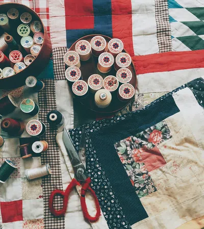 a table is filled with sewing supplies
