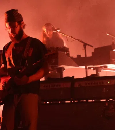 a man playing a keyboard on a stage