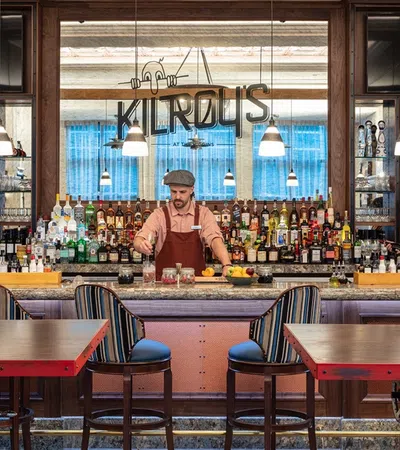 a person standing behind a counter