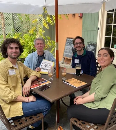 a group of people sitting around a table