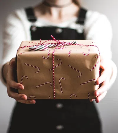 a person holding a cake