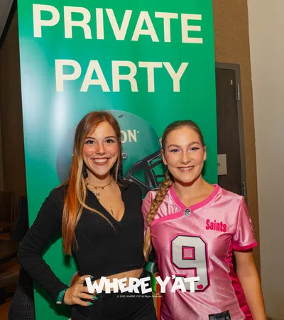 a couple of women posing for the camera