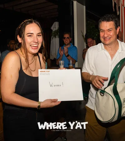 a man and woman holding a certificate