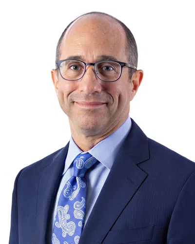 Professional man with a blue blaser and glasses