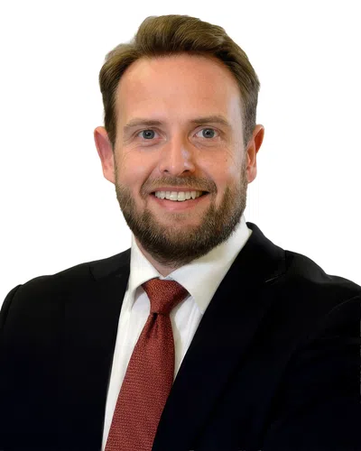 Professional man with a blue blaser and red tie