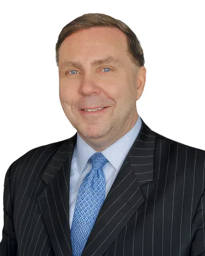 Professional man with a black blaser and blue tie