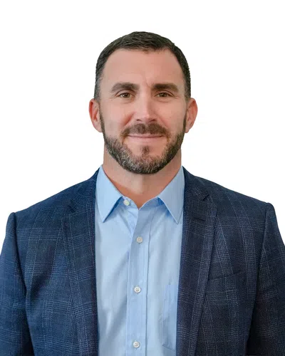 Professional man with a blue blaser and blue shirt