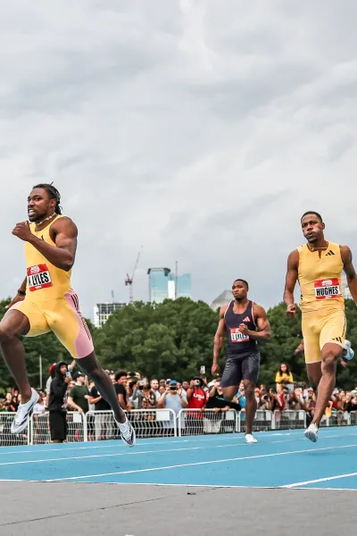 a group of people running on a track