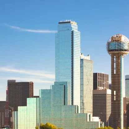 a city skyline with a globe