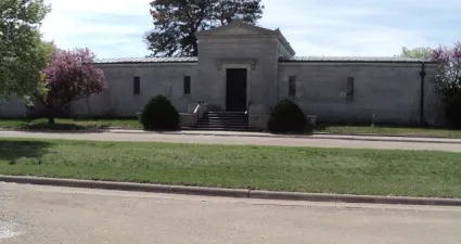 a building with a grass lawn