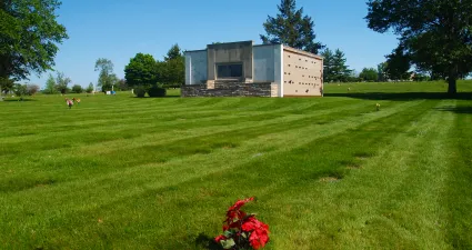a building in a grassy field