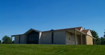 a building with a grass field