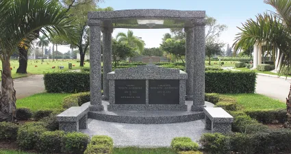 a stone monument in a park