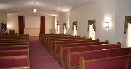 a large church with red pews