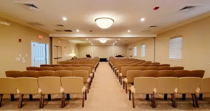 a room with chairs and tables