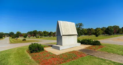 a large stone statue in a park