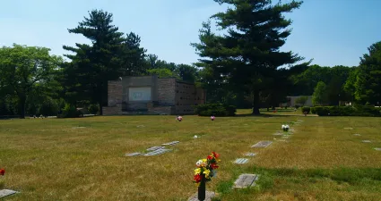 a cemetery with a stone building