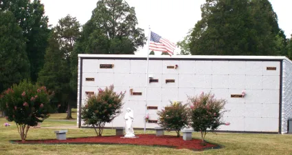 a white building with a flag on top