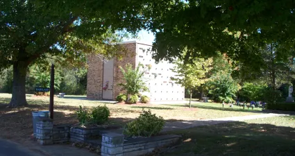 a building with a large lawn