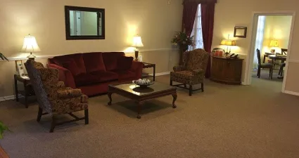 a living room with a red couch