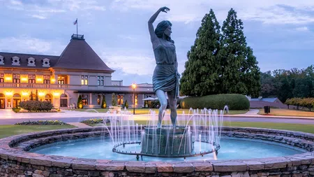 Fountain with a dancing woman statue in front of Château Élan Winery & Resort