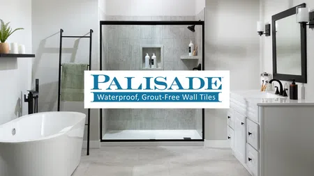 Modern bathroom with freestanding tub, black-framed shower, white vanity, and Palisade waterproof grout-free wall tiles logo.