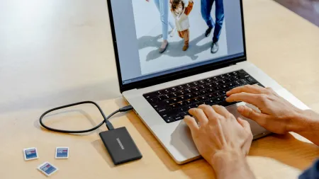 a person typing on a laptop