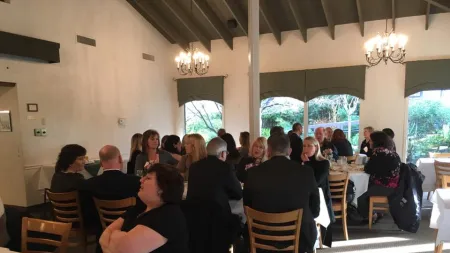 a group of people sitting at tables