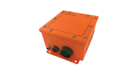 Orange industrial metal alert box with multiple connectors and secured with bolts on a white background