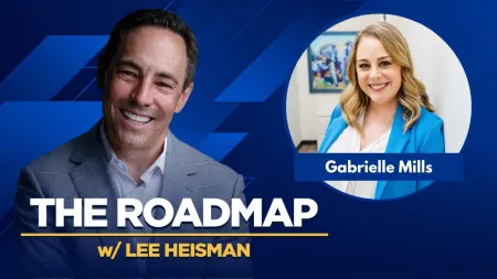 Smiling man in suit and woman in blue blazer featured in The Roadmap podcast with Lee Heisman and guest Gabrielle Mills