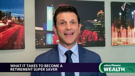 Man in blue suit and tie speaking on Yahoo Finance Wealth with cityscape artwork in background