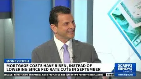 TV news segment showing expert discussing rising mortgage costs despite Fed rate cuts in September.