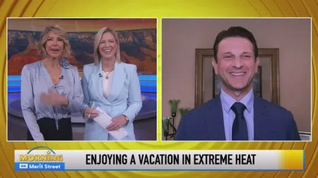 TV news hosts and guest smiling in split-screen segment about enjoying vacations in extreme heat.