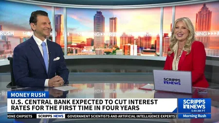 Two news anchors discussing U.S. central bank interest rate cuts on Scripps News Morning Rush show.
